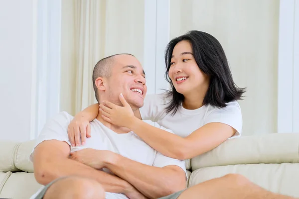 Romantic Young Couple Enjoying Leisure Time Together While Sitting Couch — Stockfoto