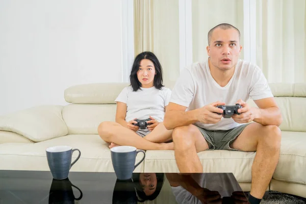 Romantic Young Couple Sitting Sofa While Playing Video Games Together — Stok fotoğraf