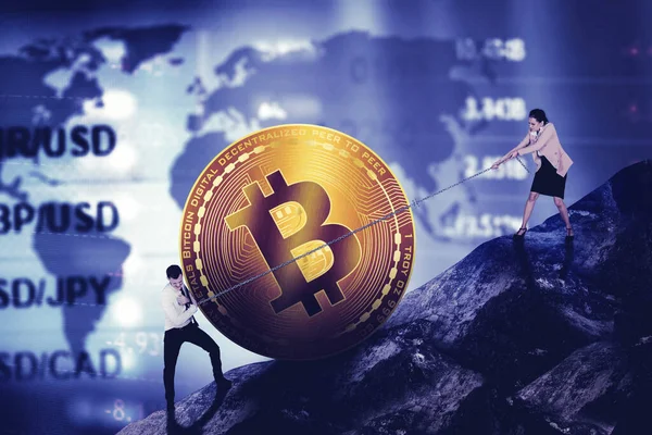 Two Business People Climbing Hill While Pulling Pushing Bitcoin Exchange — Fotografia de Stock