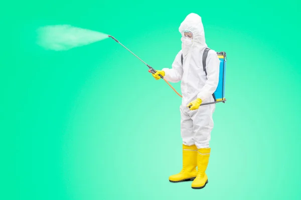 Young Man Wearing Protective Suit While Using Disinfectant Spray Prevent — Φωτογραφία Αρχείου