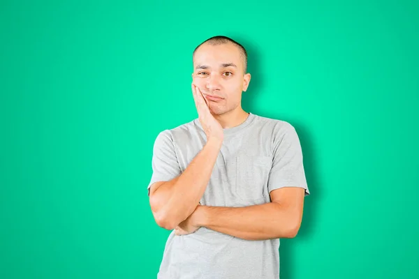 Caucasian Man Looks Bored While Thinking Something Standing Studio Green — Stock Fotó