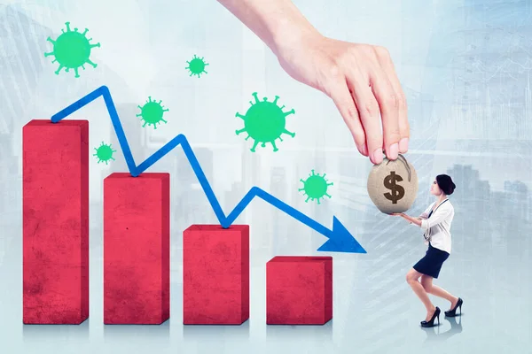 Businesswoman receiving money donation while standing with declining graph and coronavirus background