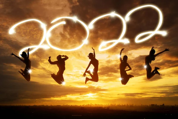 Group Silhouette Young Women Jumping Together Golden Sky While Celebrating — Stock Photo, Image