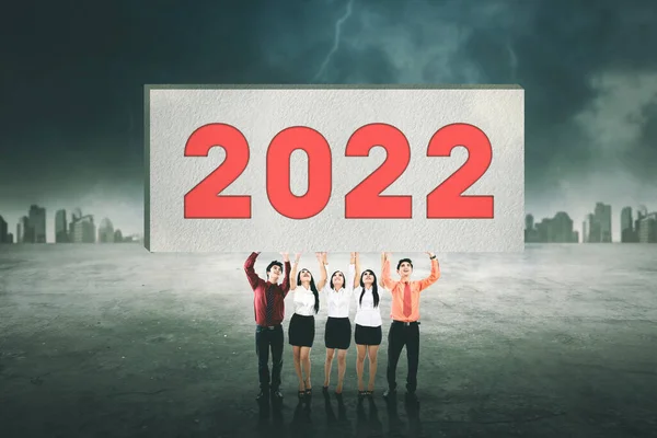 Group Young Business People Lifting Big Board 2022 Numbers While — Stock Photo, Image