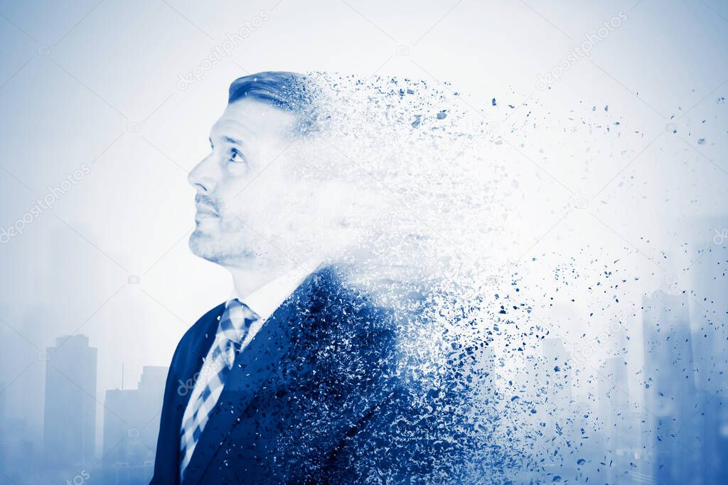 Image of male manager looks pensive while standing and changing be scattering particles with modern city background