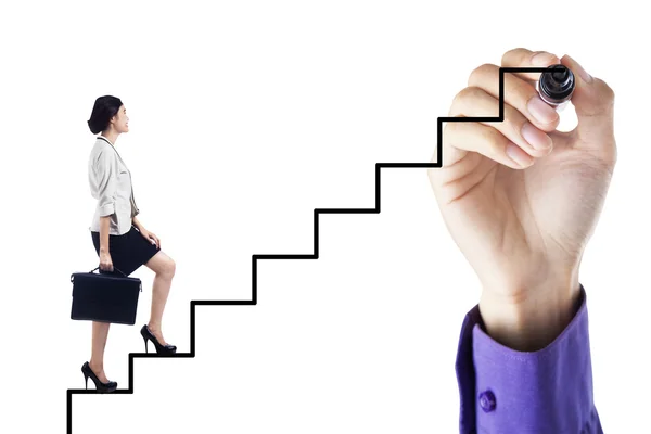 Businesswoman stepping up on ladder to success — Stock Photo, Image