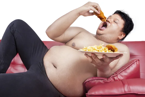 Fat man eats junk food 2 — Stock Photo, Image