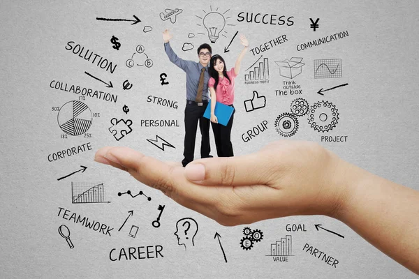 Business team standing on a palm 4 — Stock Photo, Image