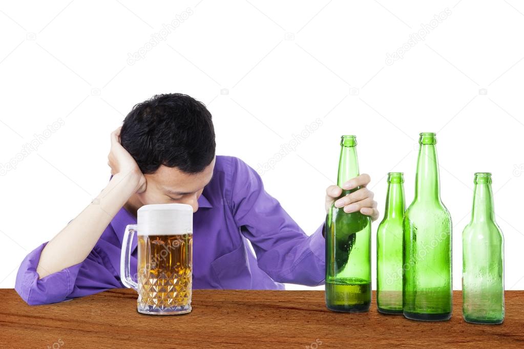 Drunk man holding beer 1