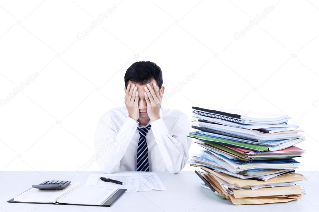 Young businessman overwhelmed