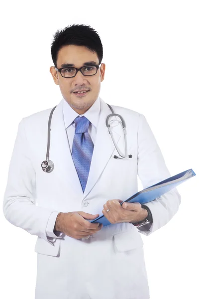 Asian doctor holding medical document — Stock Photo, Image