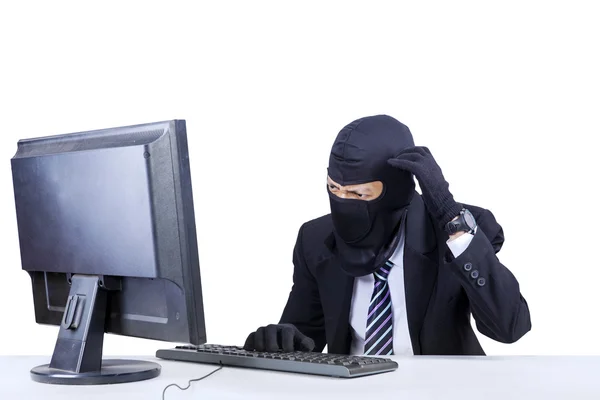 Confused hacker in business suit — Stock Photo, Image