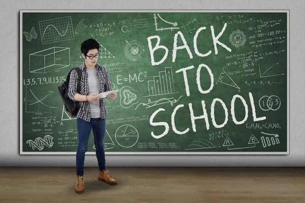 High school student standing in class — Stock Photo, Image