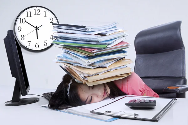 Tired woman with a pile of document — Stock Photo, Image