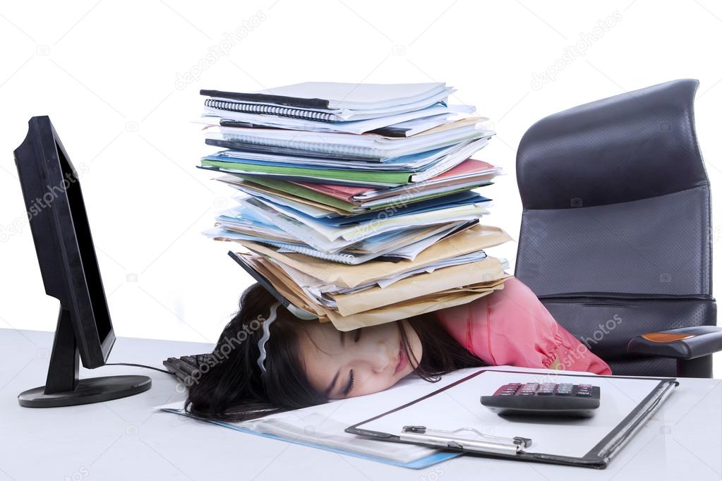 Female accountant with a pile of paperwork