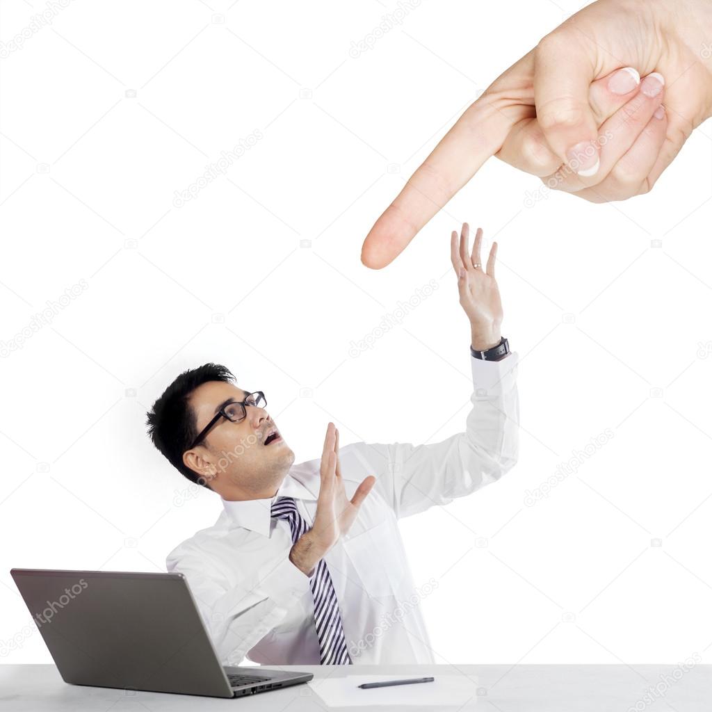 Finger pointing a businessman