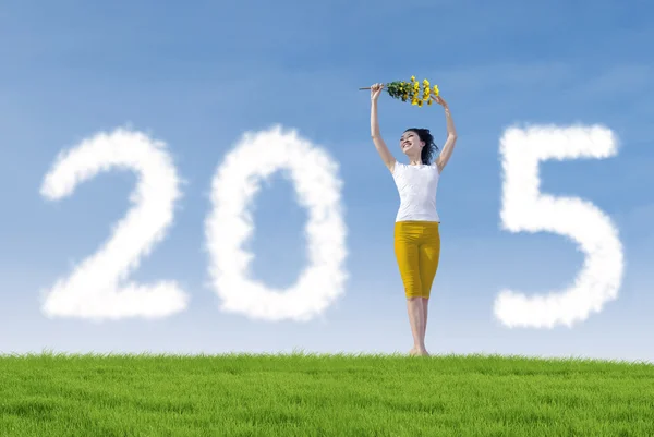 Attractive woman dancing to celebrate new year — Stock Photo, Image