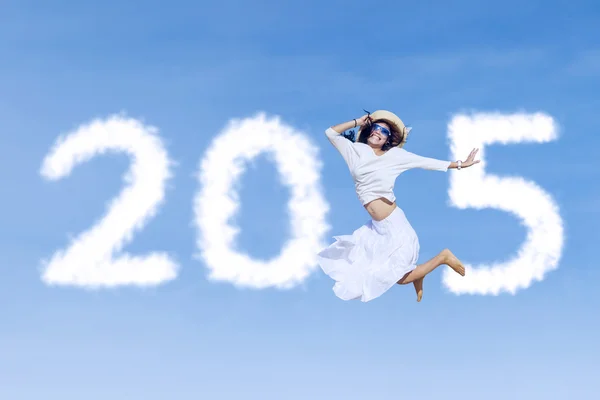 Woman with number 2015 on sky — Stock Photo, Image