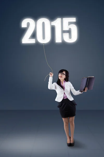 Full length woman pulling number 2015 — Stock Photo, Image