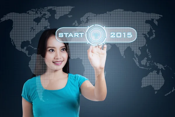 Woman touch a start button to future — Stock Photo, Image