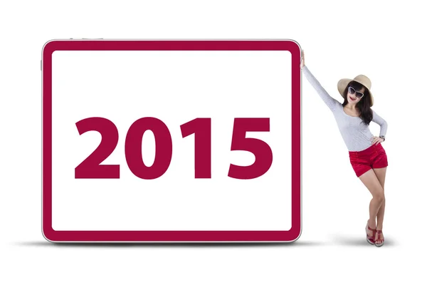 Woman with number 2015 on board — Stock Photo, Image