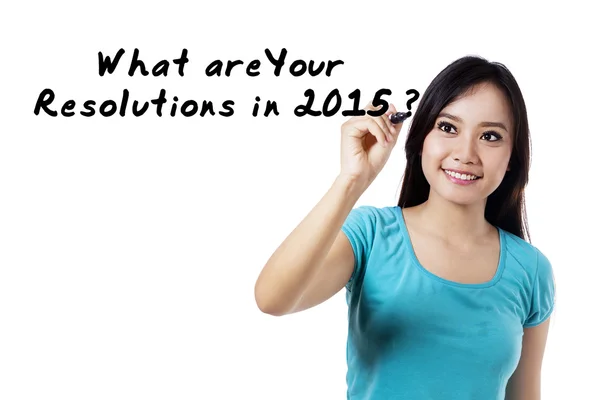 Glad tjej skriver resolutioner 2015 — Stockfoto
