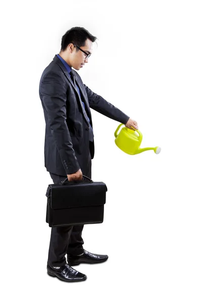 Businessman nurture something — Stock Photo, Image