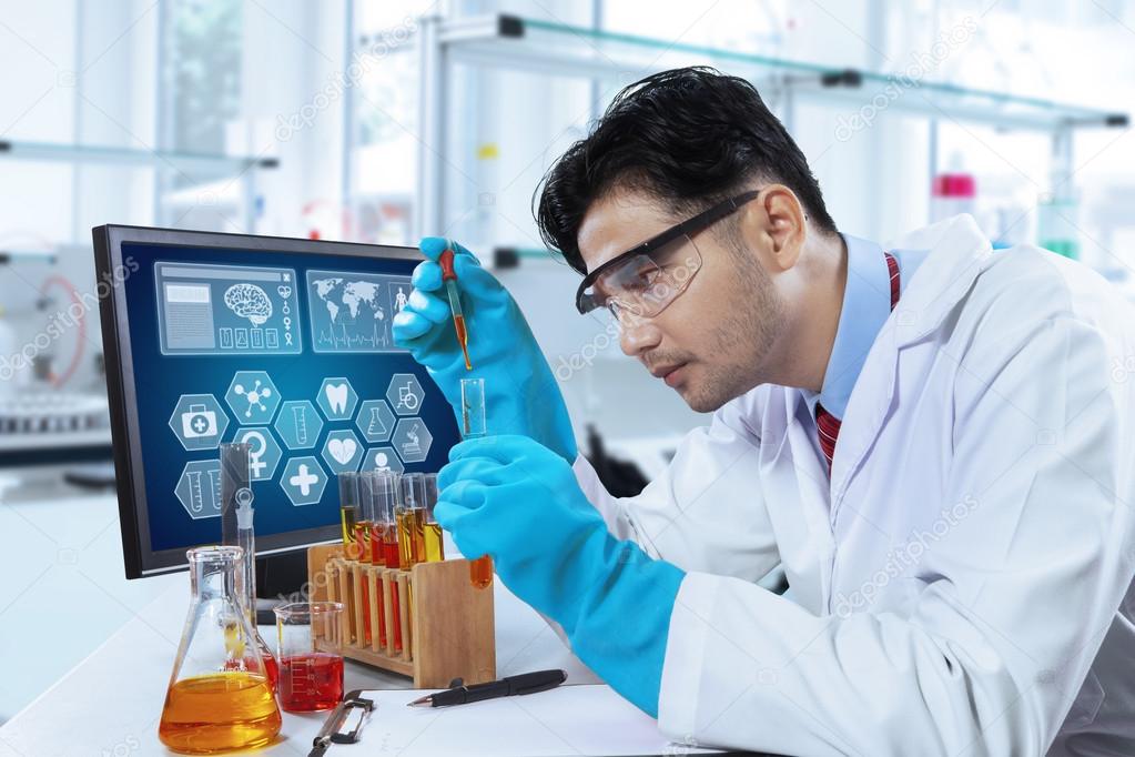 Hispanic scientist working in laboratory