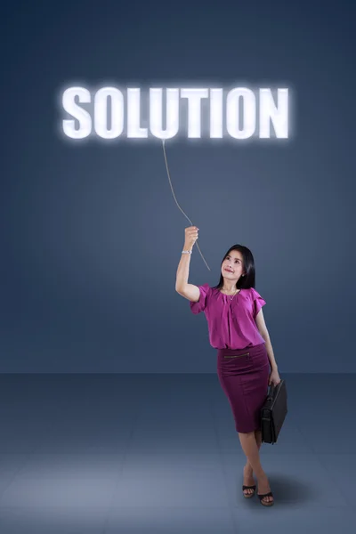 Businesswoman and a solution text — Stock Photo, Image