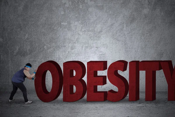 Λίπος άνθρωπος πιέζει μια λέξη παχυσαρκία — Φωτογραφία Αρχείου