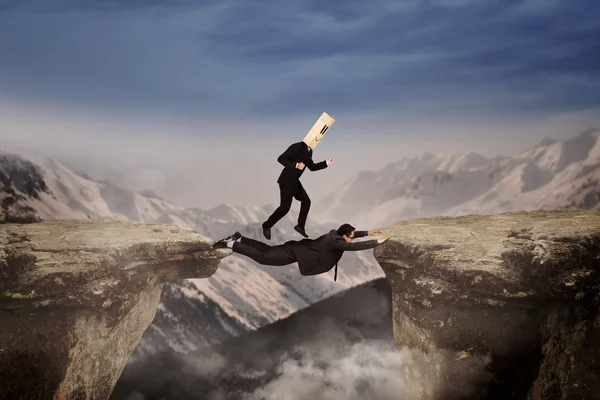 Man wearing mask above cliff — Stock Photo, Image