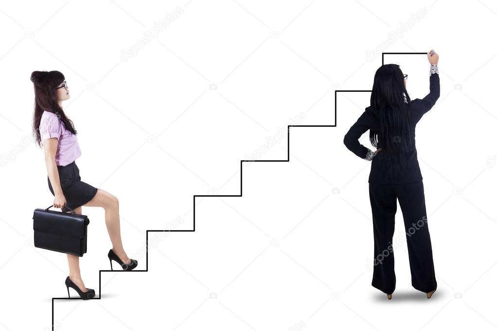 Businesswoman stepping up on stairs to success 1