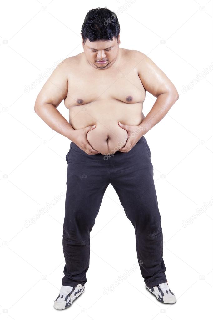 Overweight person holds his belly