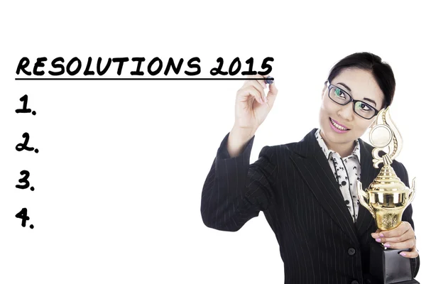 Zakenvrouw schrijft haar resoluties in 2015 — Stockfoto
