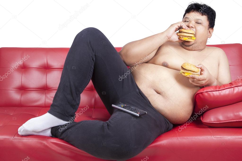 Greedy fat man eating hamburger 1