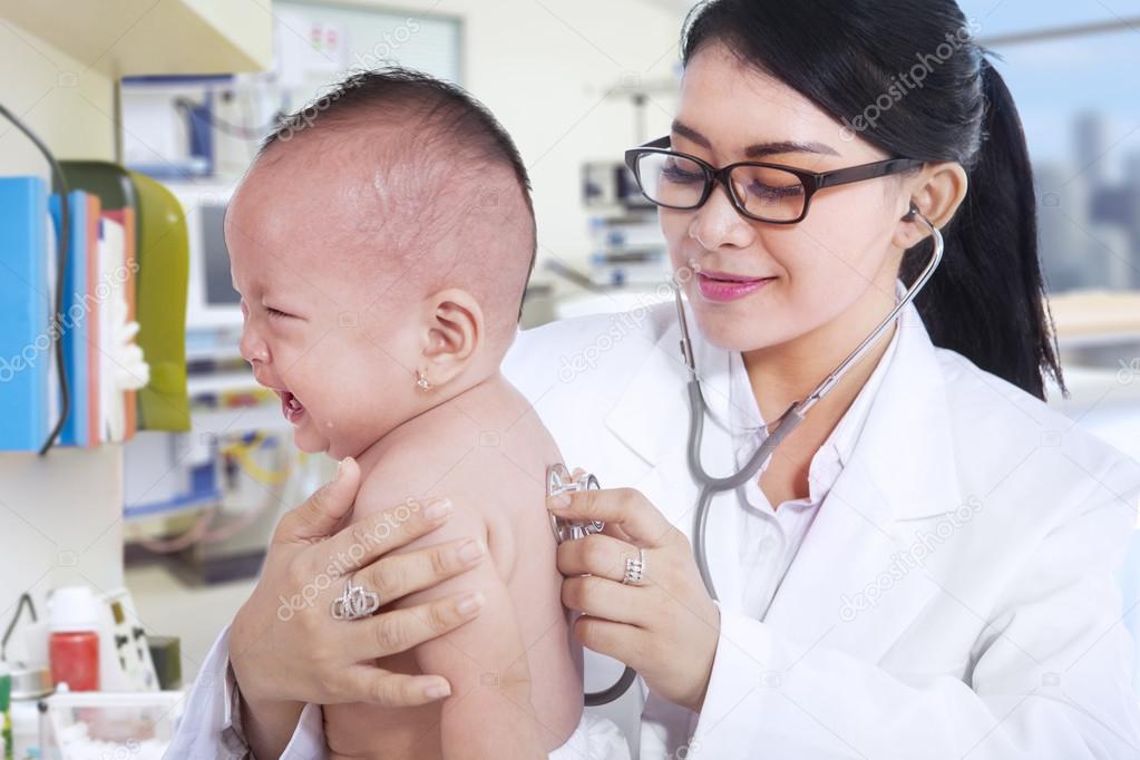 Little baby crying while visiting doctor