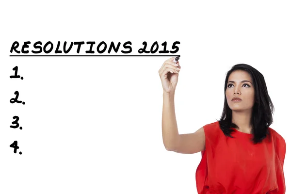 Kvinnan skriver sin resolutioner lista 2015 — Stockfoto
