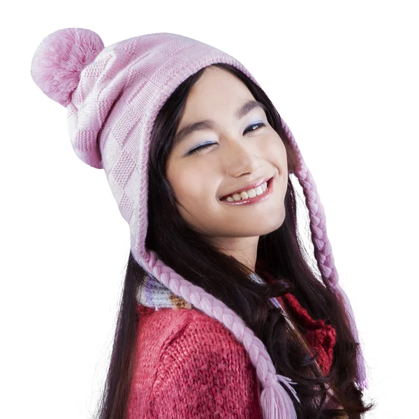 Joyful girl in winter clothes give a wink — Stock Photo, Image