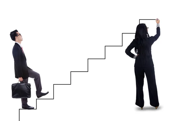 Businessman stepping up on staircase — Stock Photo, Image