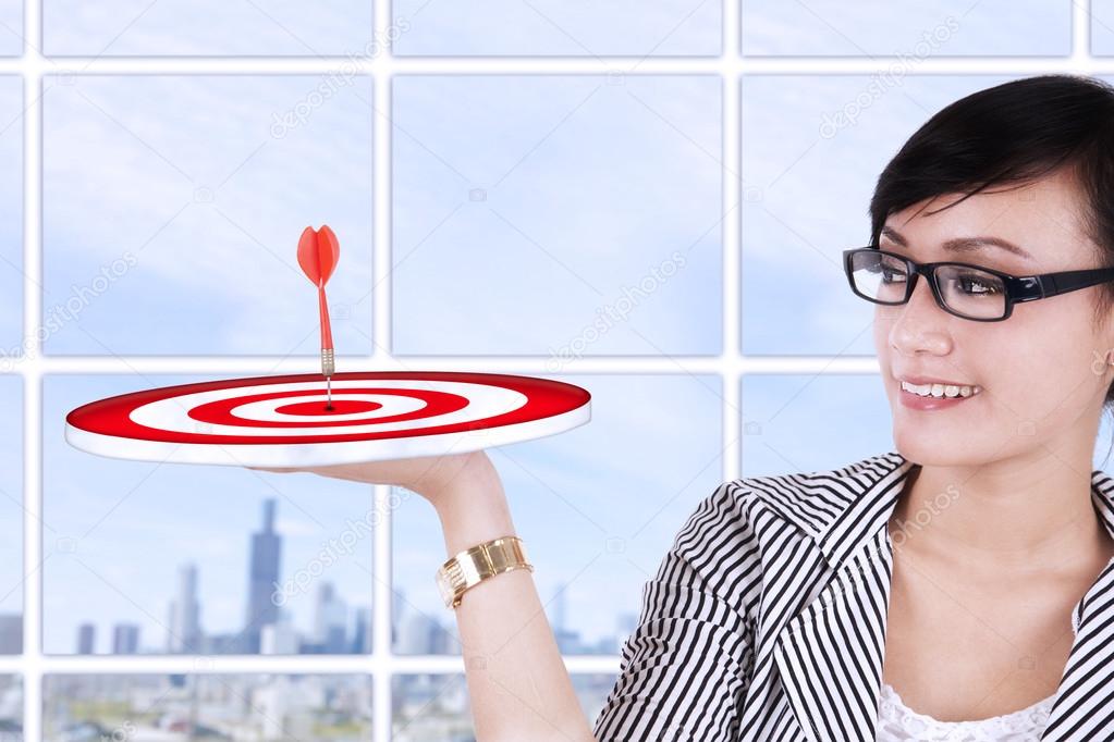 Businesswoman holding a target