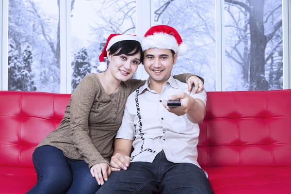 Christmas couple watching movie at home — Stock Photo, Image