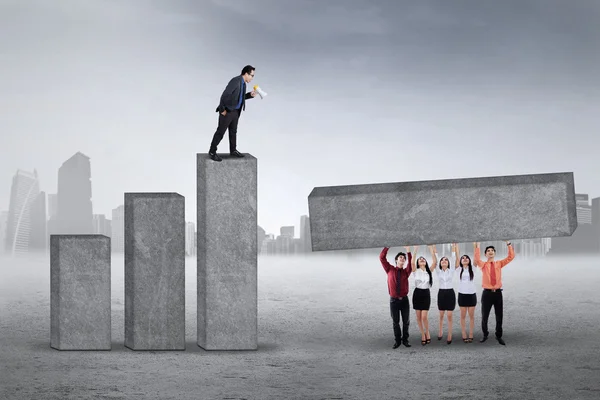 Company chief commanding his workers — Stock Photo, Image