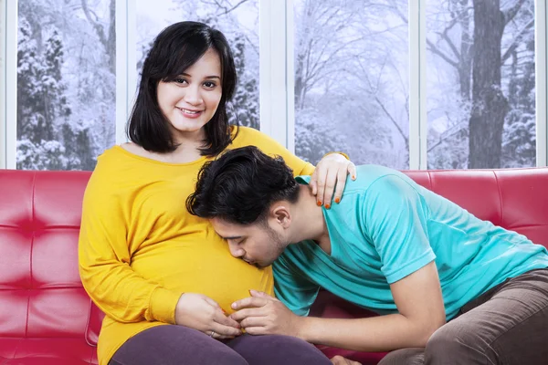 Future father kissing pregnant belly — Stock Photo, Image