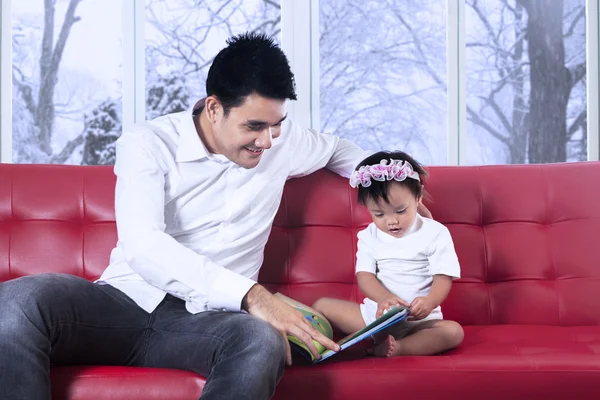 Lovely girl and father read story book — Stock Photo, Image