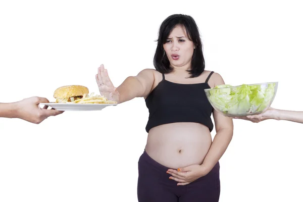 Pregnant woman refuse fast food — Stock Photo, Image