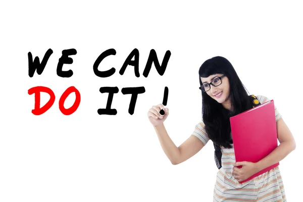 Female student writes motivation word 2 — Stock Photo, Image