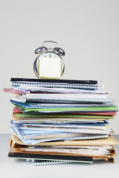 Stack of documents and alarm clock — Stock Photo, Image