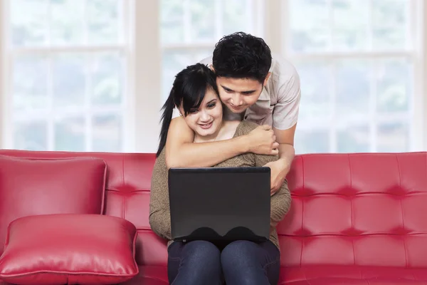 Young couple surfing internet at home 1 Stock Picture