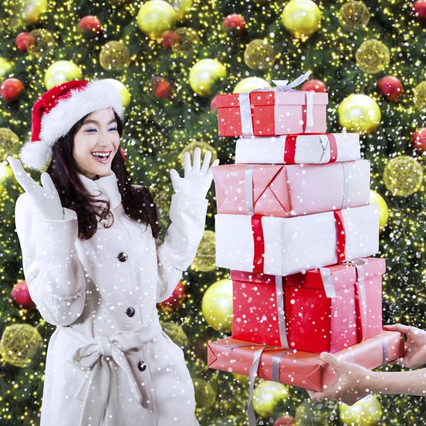 Shocked girl gets surprise gifts — Stock Photo, Image