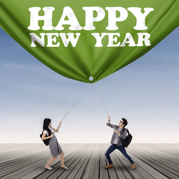 Students and new year text — Stock Photo, Image